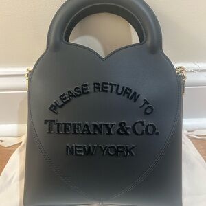 NWOT Tiffany & Co. Black Heart-Shaped mini purse with gold chain. Pristine!